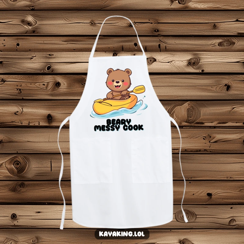 Funny Bear Apron: Smiling bear waving from a colorful kayak, a humorous and practical addition to kitchen wear.