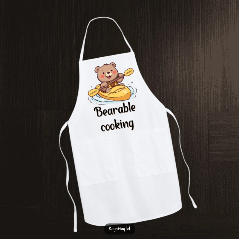 Funny apron illustrating a brave bear smiling while attempting a kayak roll, adding humor to cooking.