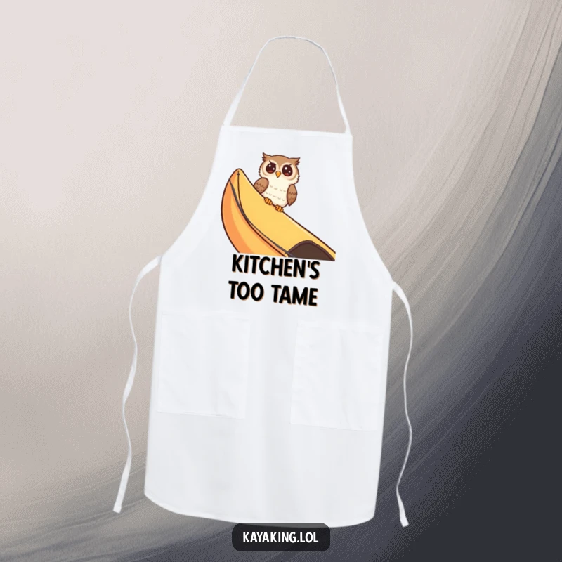 Funny giggling owl peeking over a kayak edge, adding a comical element to any cooking or crafting session. This apron is a real treat.