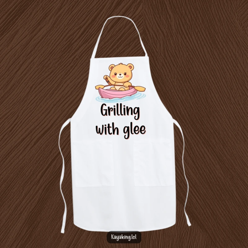 Funny Apron, a happy bear waving from a kayak, bringing cheerful charm and humor to cooking.