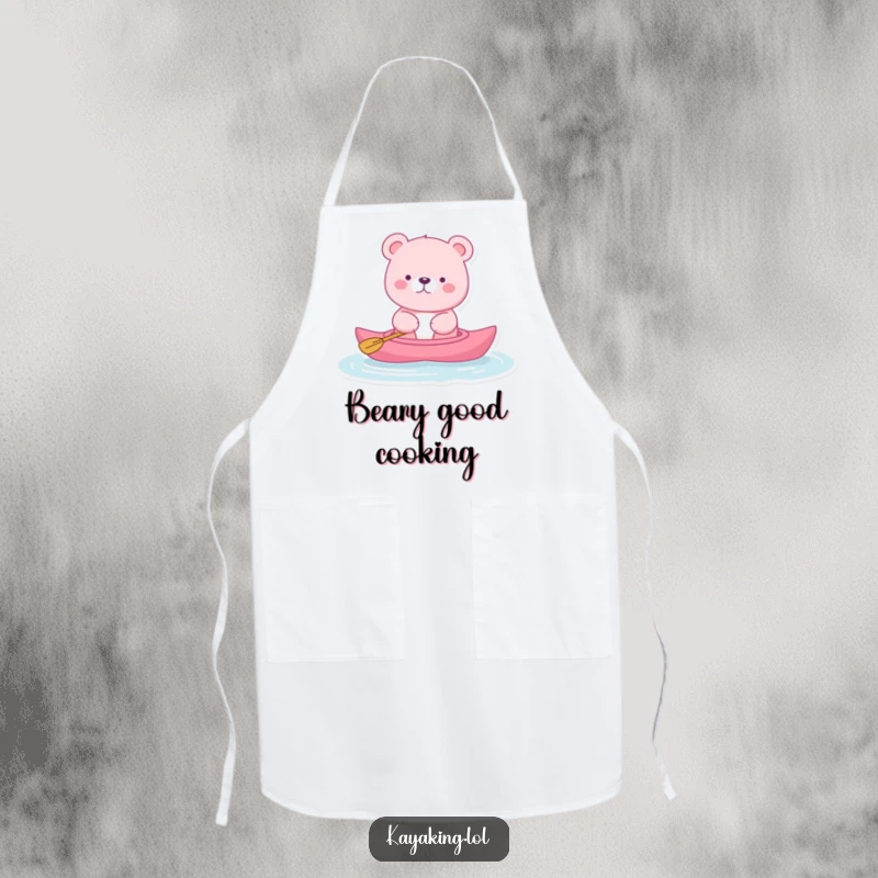 Funny pink bear apron showing a bear floating serenely in a kayak, adding humorous tranquility to kitchen tasks, a cute apron.