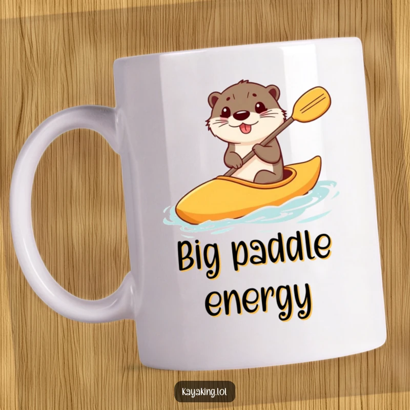 Funny mug shows a happy otter steering a kayak with a comically large paddle, looking joyful and ready for fun.