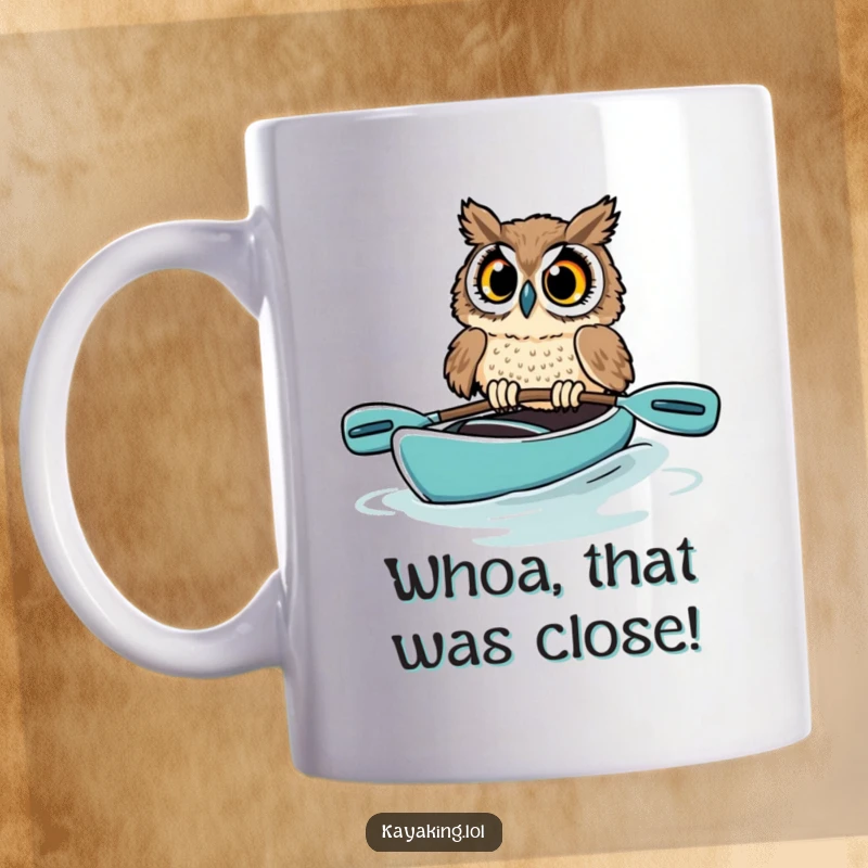 Funny owl mug featuring a startled bird in a kayak, eyes wide with panic as it nearly tips over on the water.