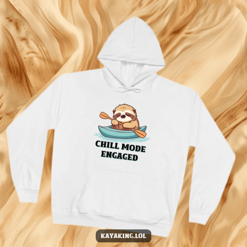 Funny sloth napping in a kayak, paddle at the ready, printed on a warm hoodie for ultimate relaxation.