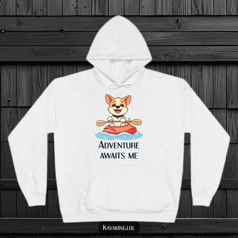 Funny happy dog kayaking hoodie depicts a joyful dog with a wide grin, confidently paddling a kayak, ready for cozy adventures.