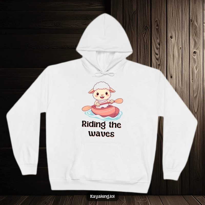 Funny hoodie featuring a happy sheep with a big grin, confidently paddling its kayak, ready for aquatic fun.