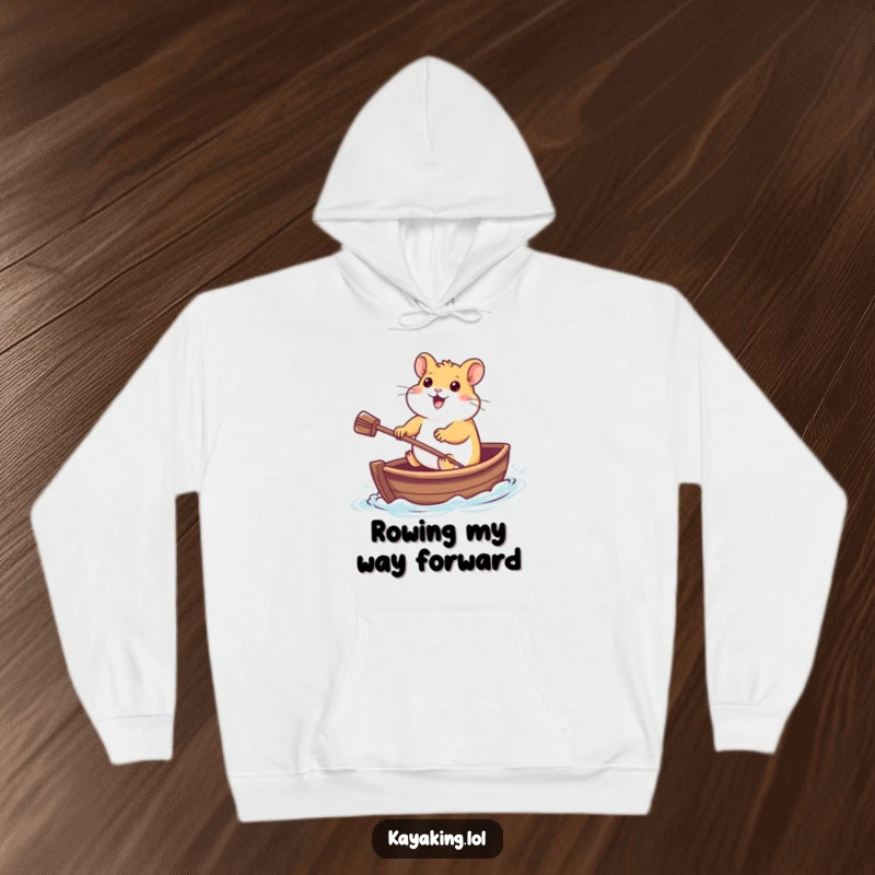 Funny Hoodie: A cheerful hamster navigating a tiny boat with a paddle, showcasing a funny and delightful aquatic adventure.