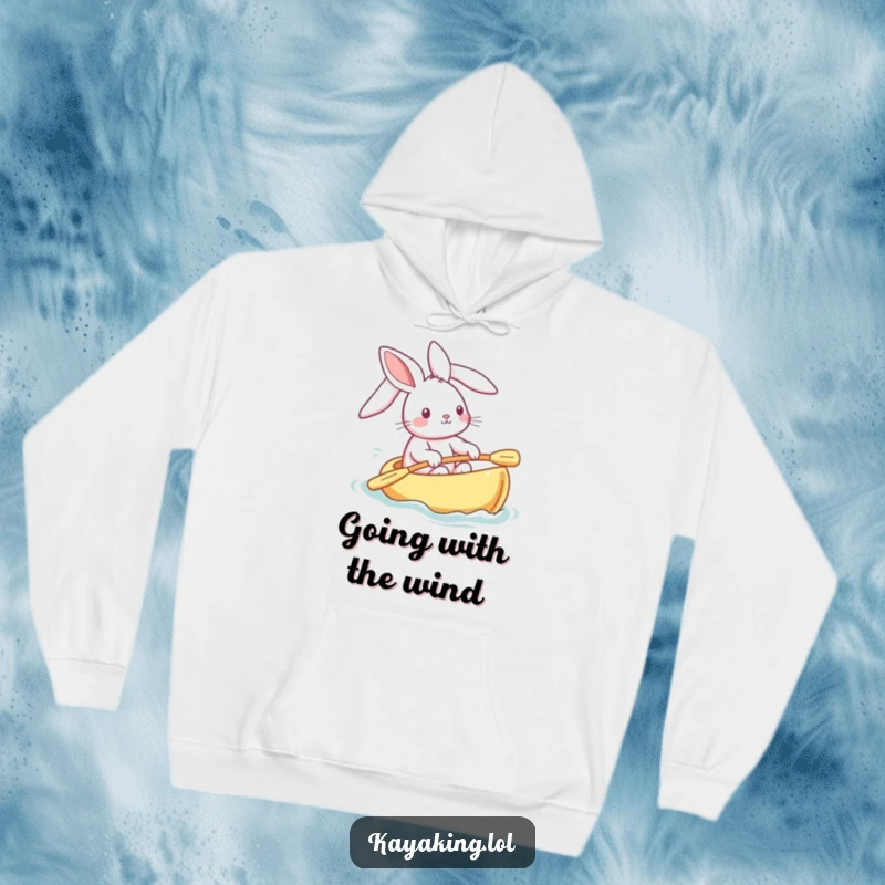 Funny bunny hoodie showing a happy rabbit steering a kayak, ears streaming, embodying playful adventure and cozy comfort.