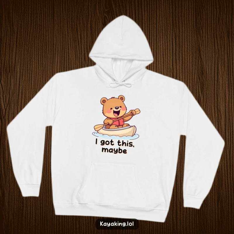 Funny hoodie featuring an excited bear hilariously trying to steer a kayak with a paddle, designed for comfort and a touch of wild fun.