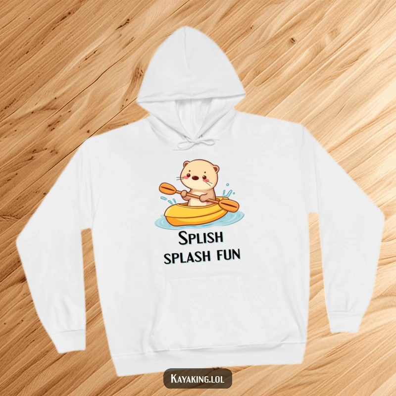 Funny hoodie with a playful otter splashing water from a kayak, embodying pure, wet fun.