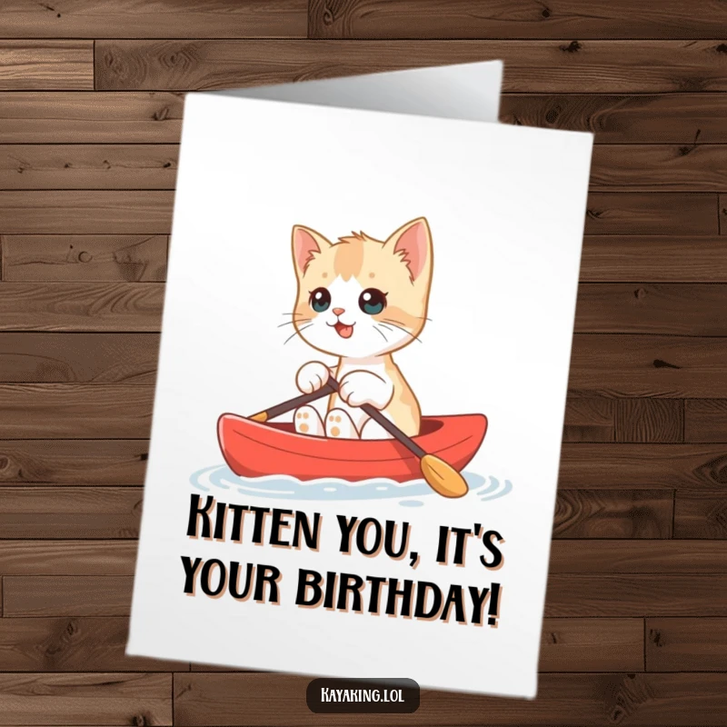 Funny Free Printable Birthday Card: Cute kitten paddling a tiny red kayak with a goofy grin, ready for adventure.