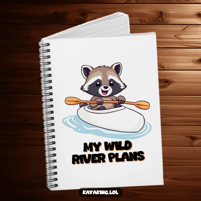 Funny raccoon steering a kayak with paw on paddle, presented on a notebook cover, inspiring joyful note-taking and outdoor dreams.