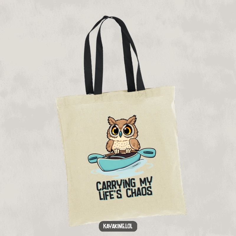 Funny owl tote bag showcasing a startled bird in a kayak, its wide eyes conveying a moment of pure, hilarious panic on the water.